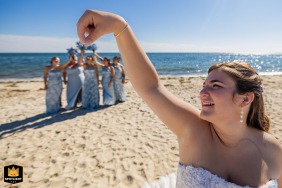 Portrait of a bride at Bank Street Beach in Harwich, MA, creatively framed to highlight their playful connection and the artistic perspective of their celebration.